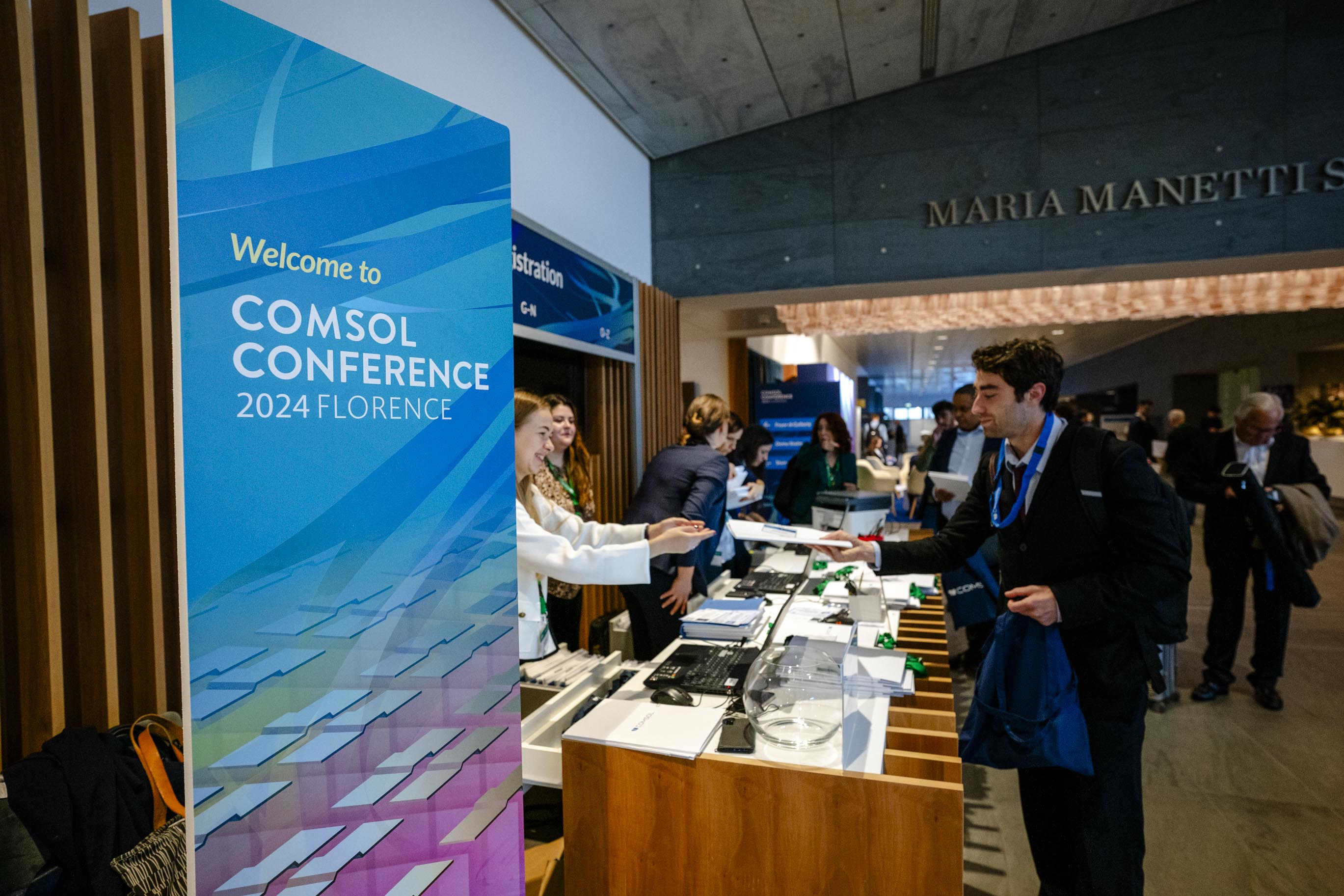 Upon checking into the conference, attendees received the program, name badge lanyards, and more.